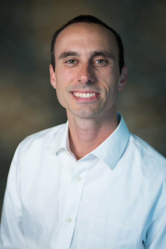 A professional headshot of Tulane faculty member, Aron Culotta